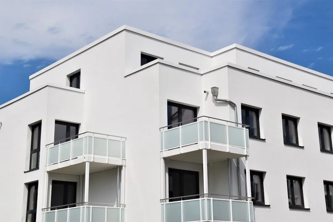 White concrete building under blue sky during daytime