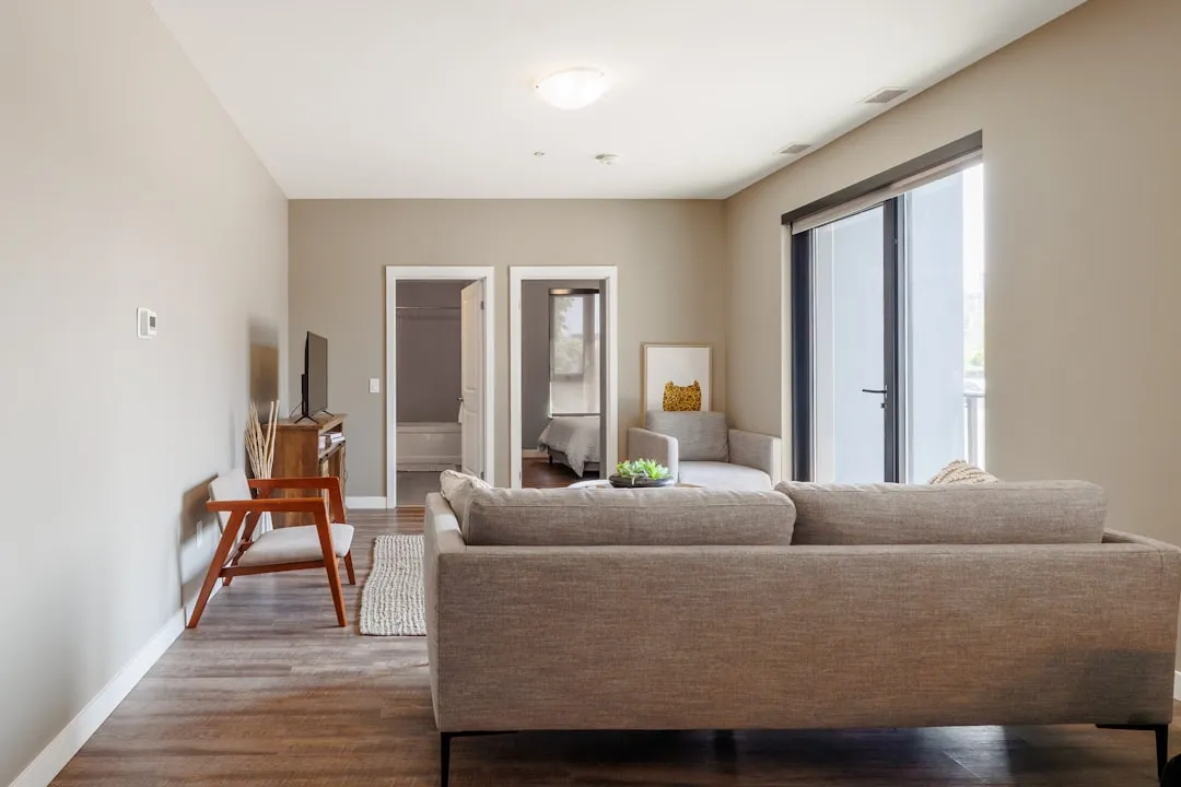 Modern living room with sofa and chairs.