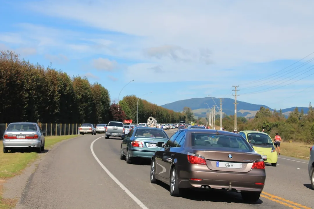 A bunch of cars that are sitting in the street