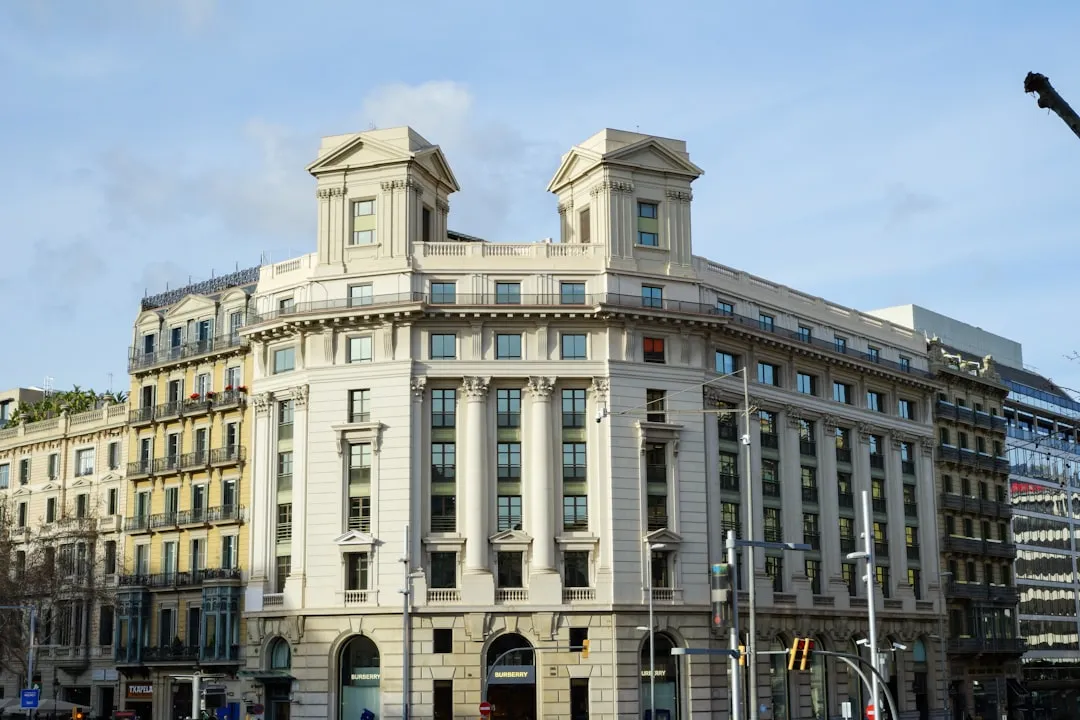 A large white building sitting on the corner of a street